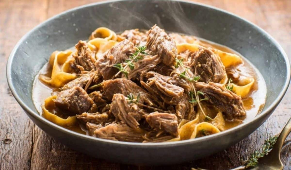 Slow cooker beef roast in rustic kitchen