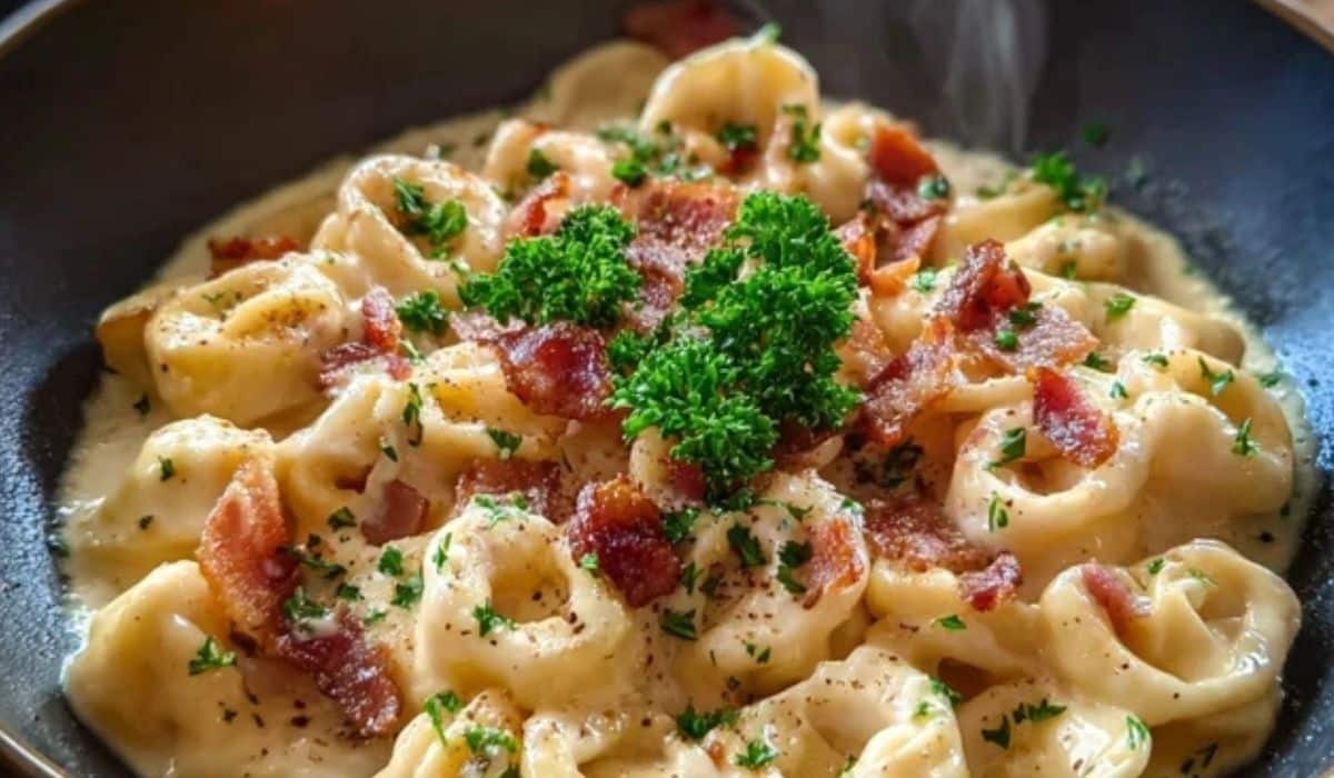 Creamy Tortellini Carbonara in bowl with bacon and parsley