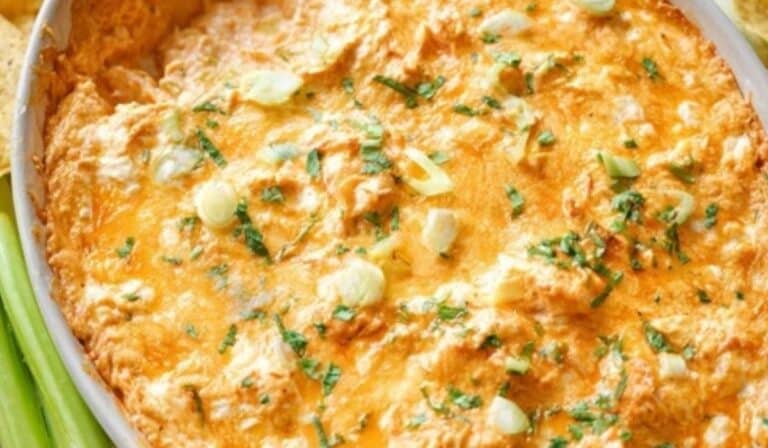 Greek Yogurt Buffalo Chicken Dip bubbling hot in dish