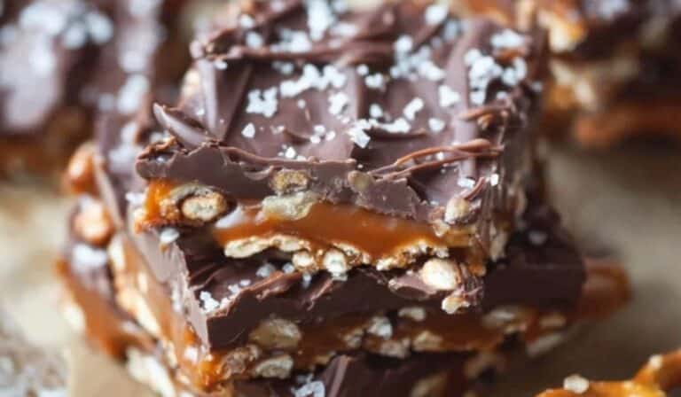 Salted Chocolate and Caramel Pretzel Bars stacked with caramel and sea salt