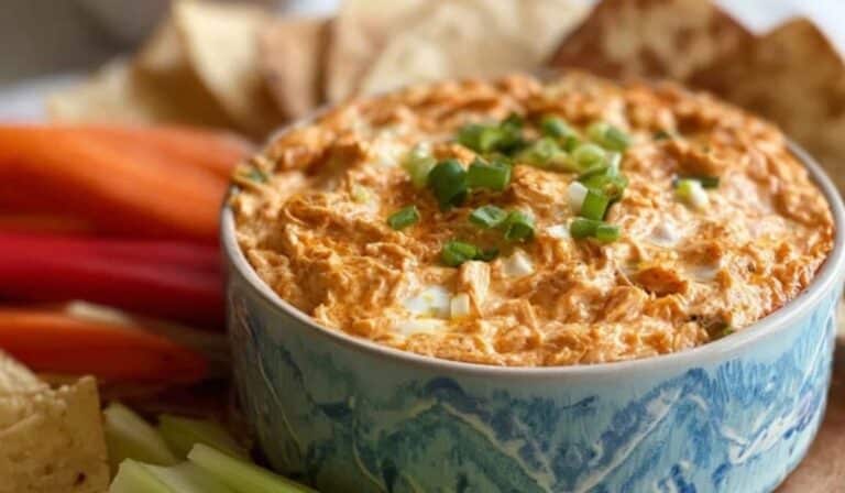 Healthy Buffalo Chicken Dip served hot with veggies