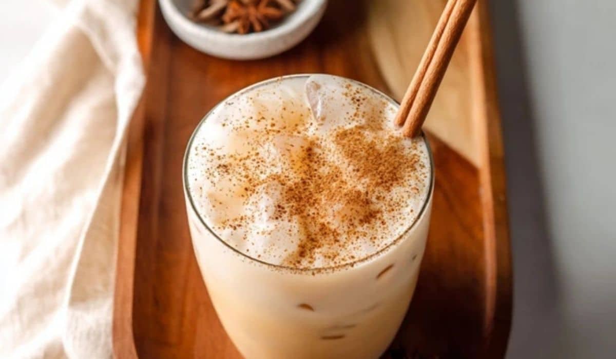 Iced Chai Tea Latte with swirling milk and chai spices
