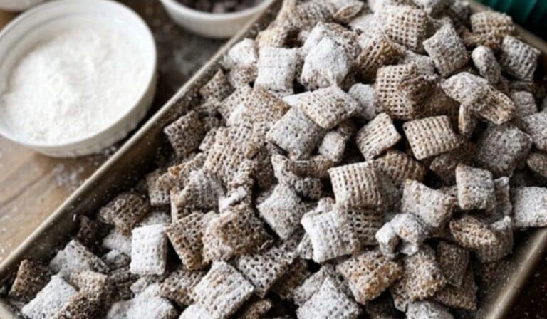 Homemade Muddy Buddies Chex Mix on rustic kitchen table