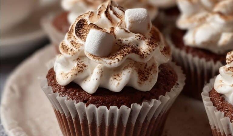 Hot Cocoa Cupcakes w/ Marshmallow Frosting on wooden table