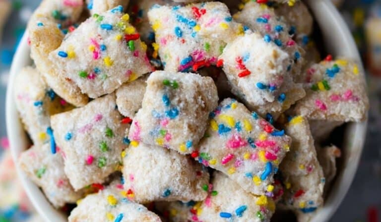 Cake Batter Puppy Chow in bowl with sprinkles