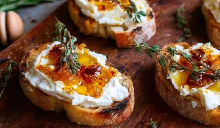 Spicy Honey Drizzled Feta Crostini on rustic board