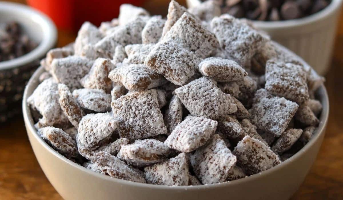 Easy Puppy Chow Recipe bowl coated in powdered sugar