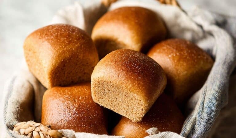 Honey Whole Wheat Dinner Rolls in rustic basket