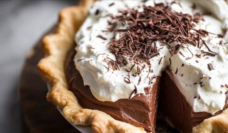 French Silk Pie with whipped cream and chocolate shavings