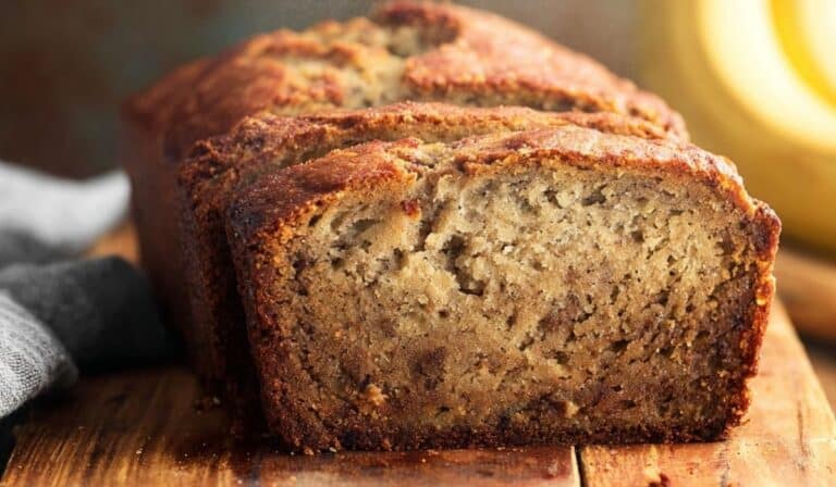 Banana bread recipe freshly sliced on table