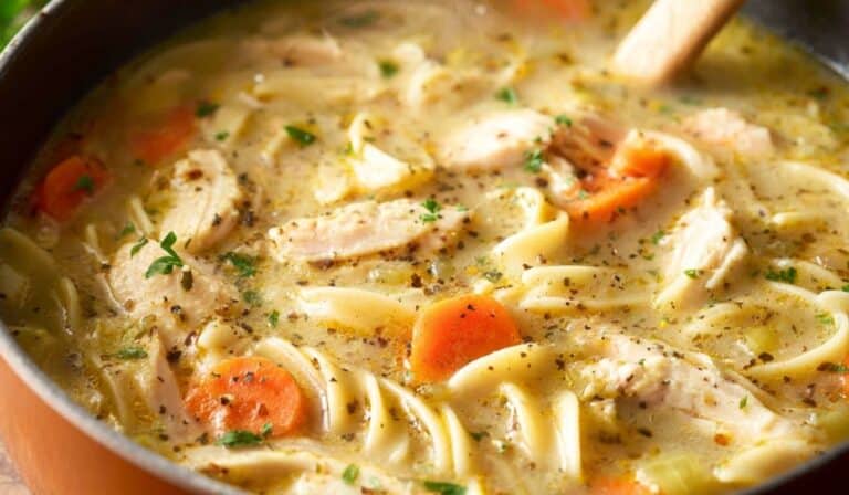 chicken noodle soup in rustic kitchen