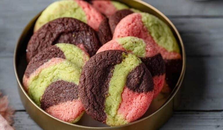 Spumoni Cookies in a festive tin with cherry, pistachio, and chocolate layers