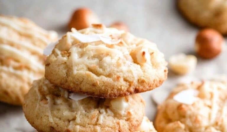 Coconut Macadamia Nut Cookies stacked on table