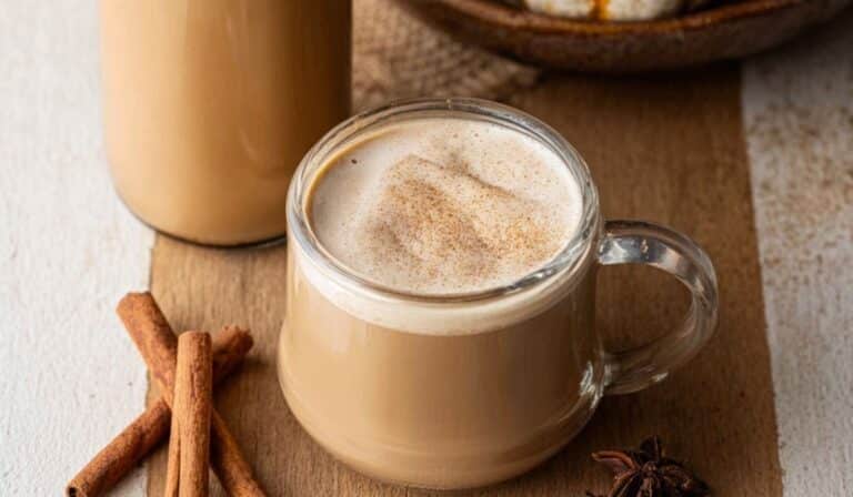 Homemade Pumpkin Coffee Creamer in a cozy fall setup