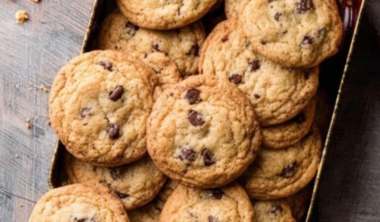 Crispy Chocolate Chip Cookies arranged in vintage tin