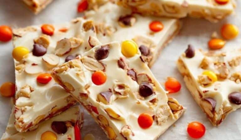Reese’s Pieces Peanut Butter White Chocolate Bark on parchment