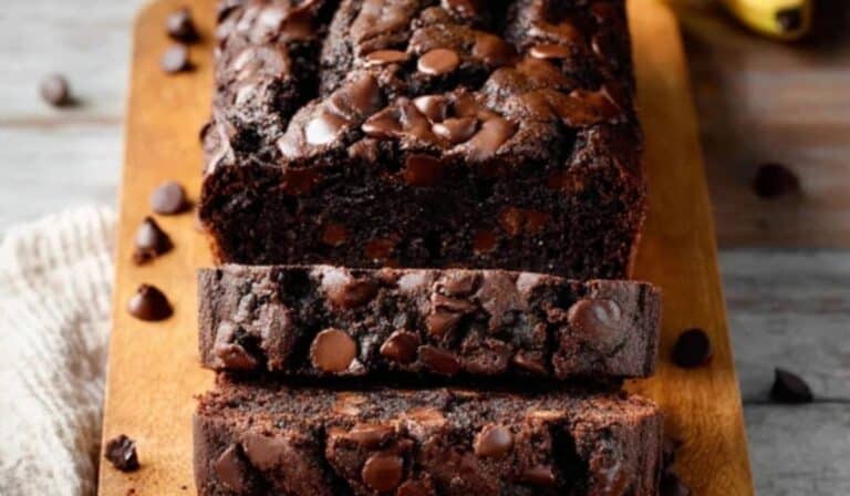 Double Chocolate Banana Bread sliced on a wooden table