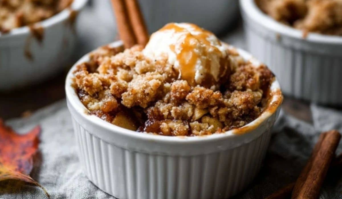 Individual Apple Crumbles in ramekins on fall table