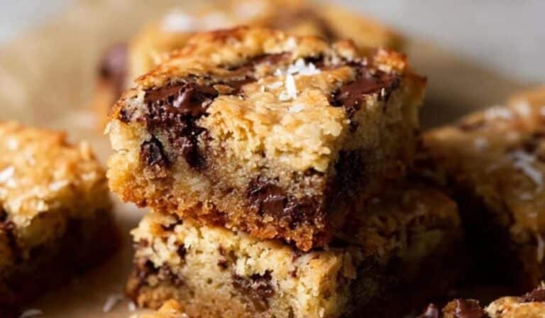 Dark Chocolate Coconut Blondies on rustic table