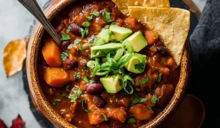 Vegetarian Pumpkin Chili in rustic bowl with fall garnish