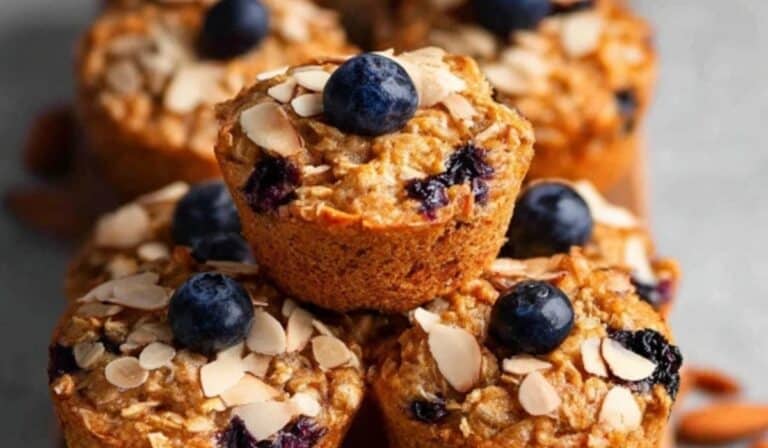 Blueberry Almond Power Muffins stacked fresh on a board