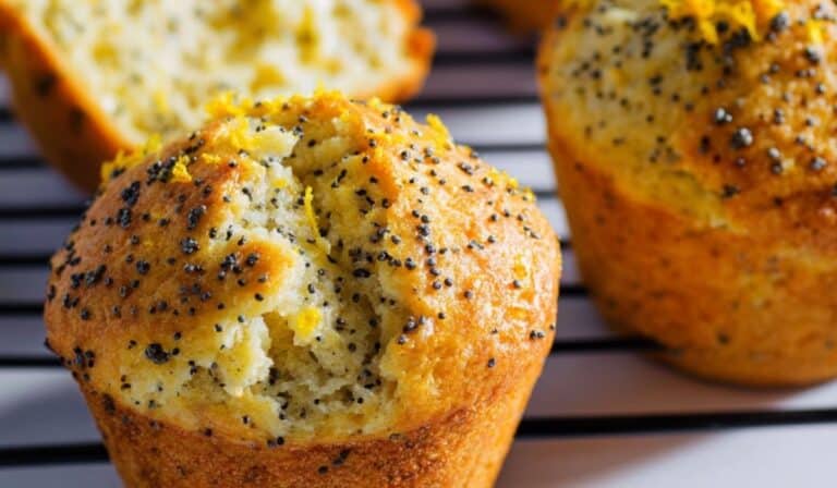 Orange Lemon Poppy Seed Muffins fresh on a rustic cooling rack