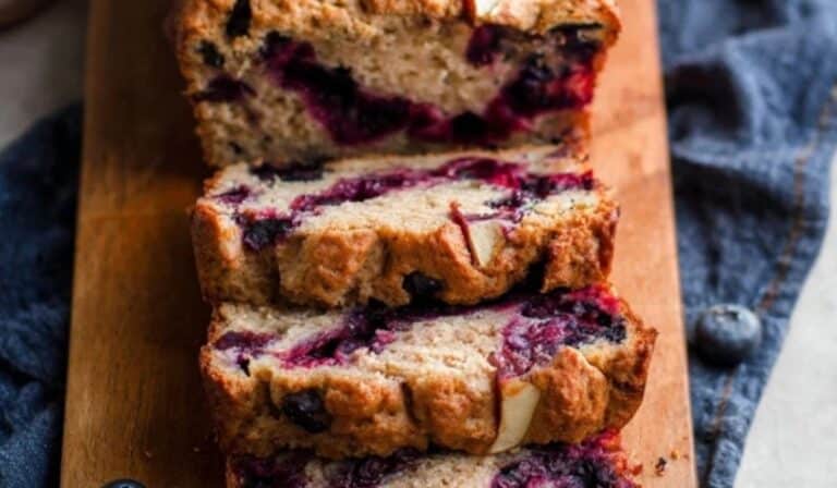 Greek Yogurt Apple Blueberry Bread sliced on board