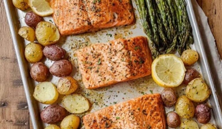 Sheet pan salmon and asparagus with potatoes roasted on a pan