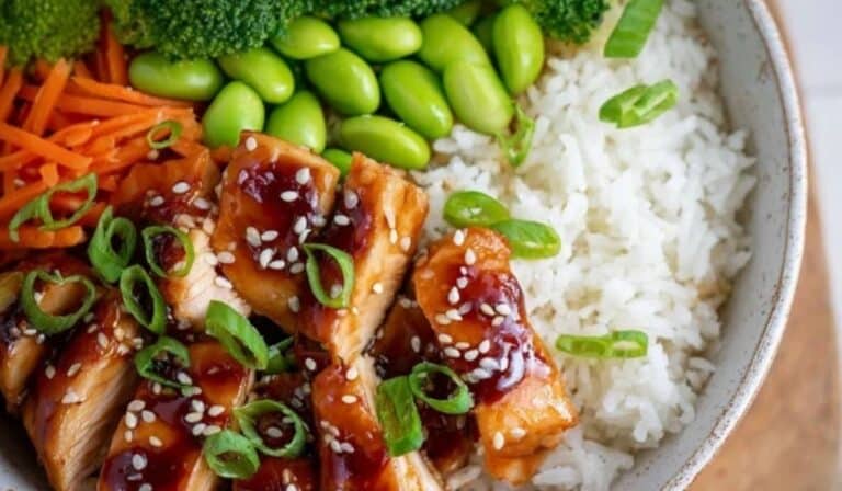 Baked Teriyaki Chicken Bowl with rice, veggies, and sesame seeds