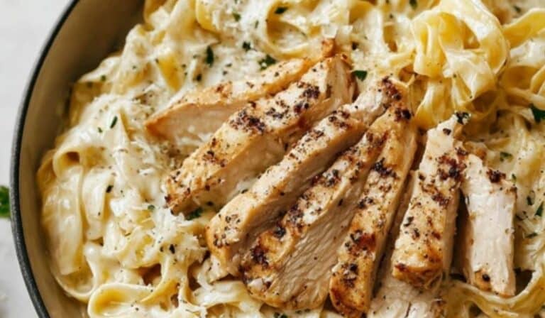 Chicken Fettuccine Alfredo in a bowl with creamy Parmesan sauce