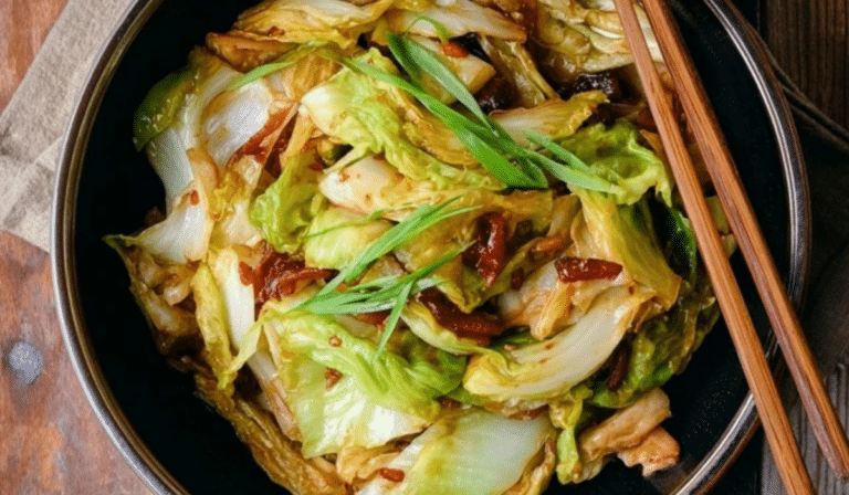 Chinese cabbage stir-fry in a wok with garlic and soy sauce