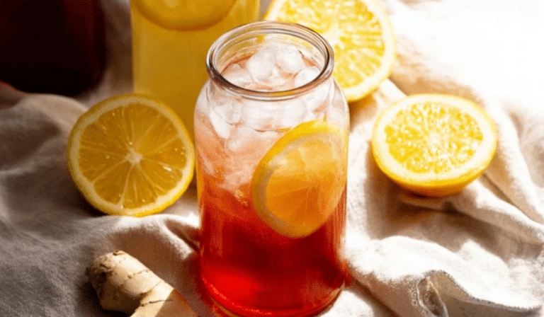 Easy Homemade Probiotic Soda in swing-top bottles with lemon and ginger