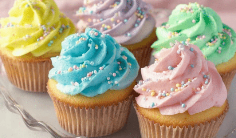 Spring Vanilla Cupcakes with pastel buttercream swirls on a marble surface