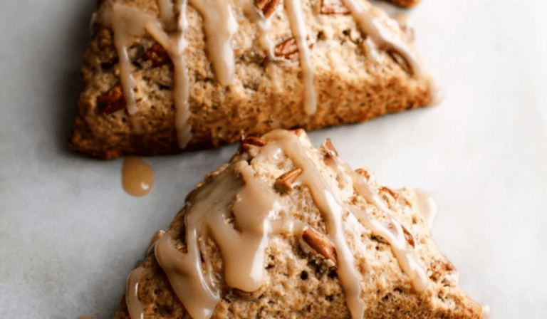 Vegan banana nut scones with maple glaze on a baking tray