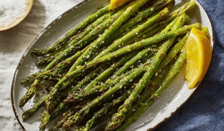 Roasted Asparagus on a sheet pan with lemon and crisp browned tips