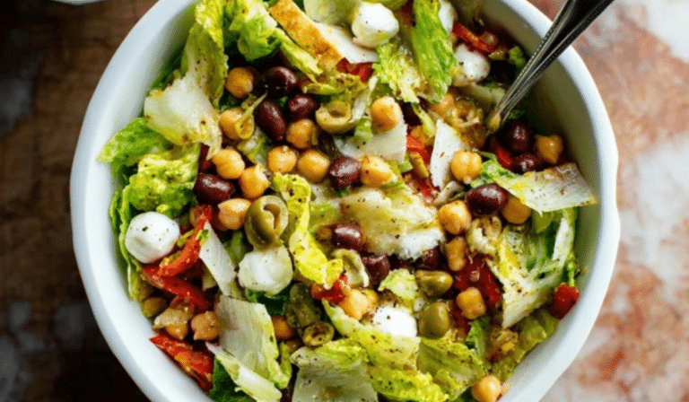 Vegetarian Italian Chopped Salad with chickpeas, olives, and pepperoncini in a big bowl