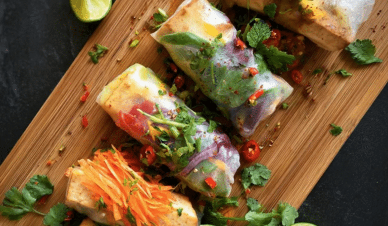 Tofu Spring Rolls with Pickled Veggies sliced with herbs and lime