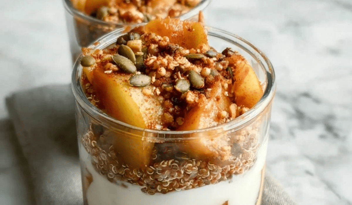 Pear & quinoa parfait jars layered with yogurt, quinoa, and cinnamon pears