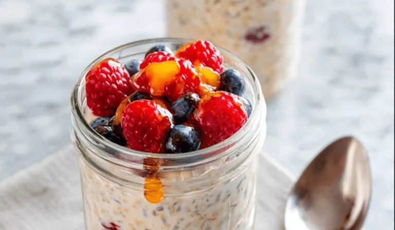 Easy Overnight Oats Recipe in a jar with berries and honey