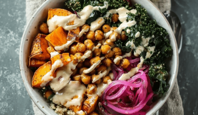 Sweet Potato Chickpea Buddha Bowl with quinoa, kale, avocado, and tahini drizzle