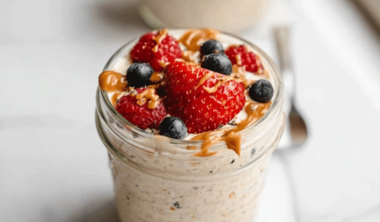 Protein overnight oats in a jar with berries and almond butter