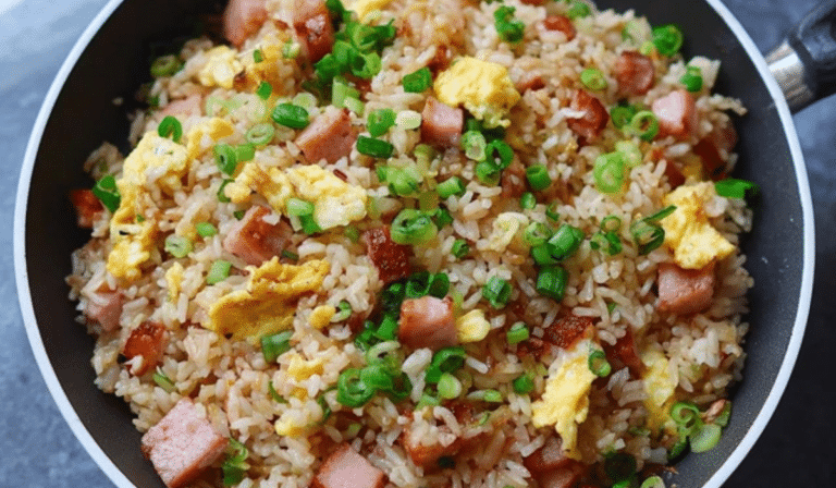 Ham and Egg Fried Rice in a skillet with fluffy eggs and diced ham